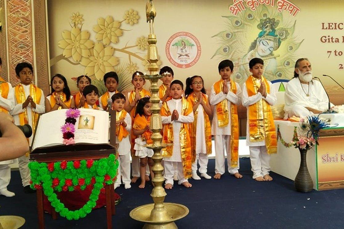 Children at a Gita festival with Maharaj Ji