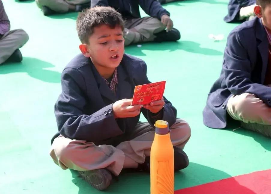 A young student reciting Gita shlok